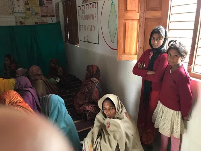Women in a room waiting for a consultation with an auxiliary nursing midwife