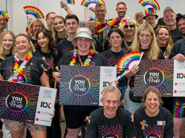 Elsevier CEO Kumsal Bayazit and LexisNexis Risk Solutions CEO Mark Kelsey (front row) pose with RELX Pride colleagues before joining them to walk in the London Pride Parade.