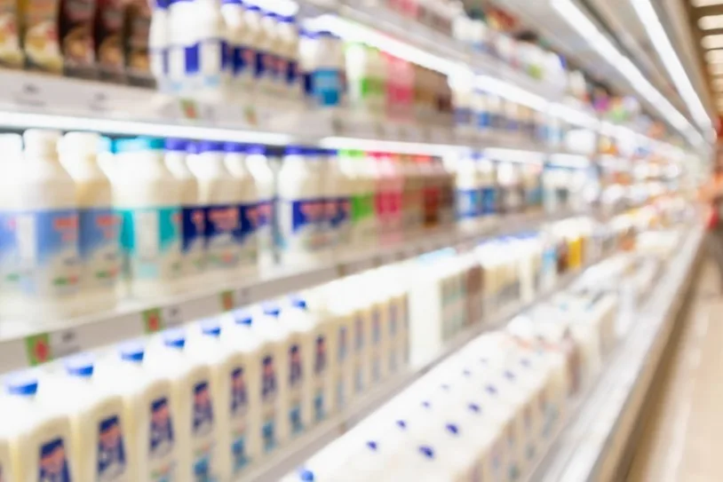 Shelves of milk in supermarket