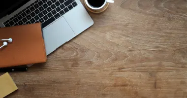Office items on a wooden desk