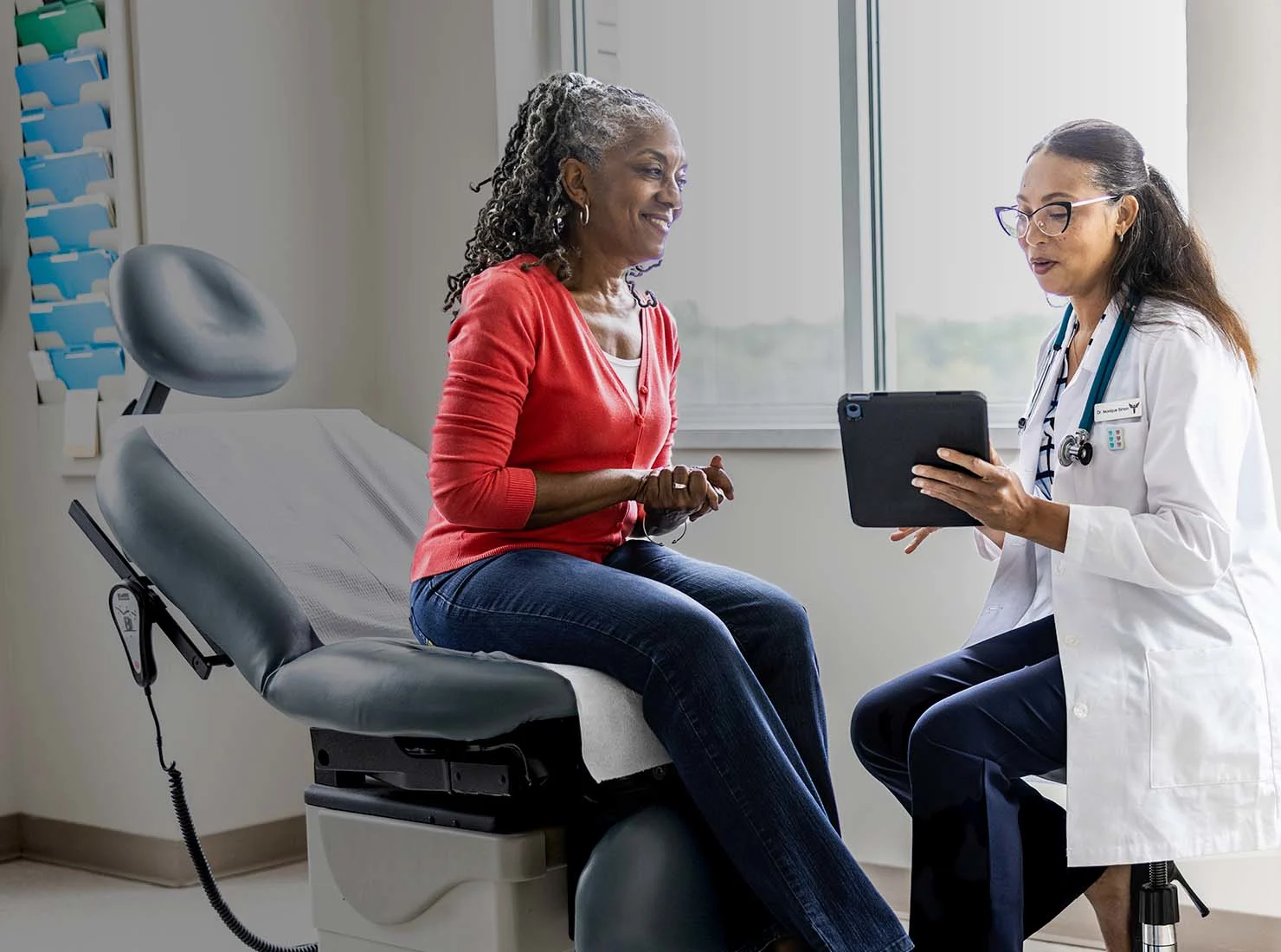 Demale physician showing information on a tablet to a female patient. (Source: MoMo Productions/DigitalVision via Getty Images)