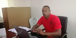 Dr. Sunday Makama in his office