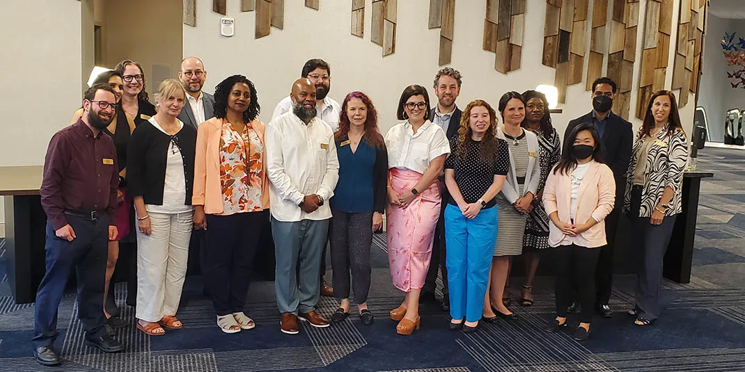 The Board of the Society for Scholarly Publishing (SSP) Author Simon Holt is on the far left and author Meredith Adinolfi is in the blue pants. 