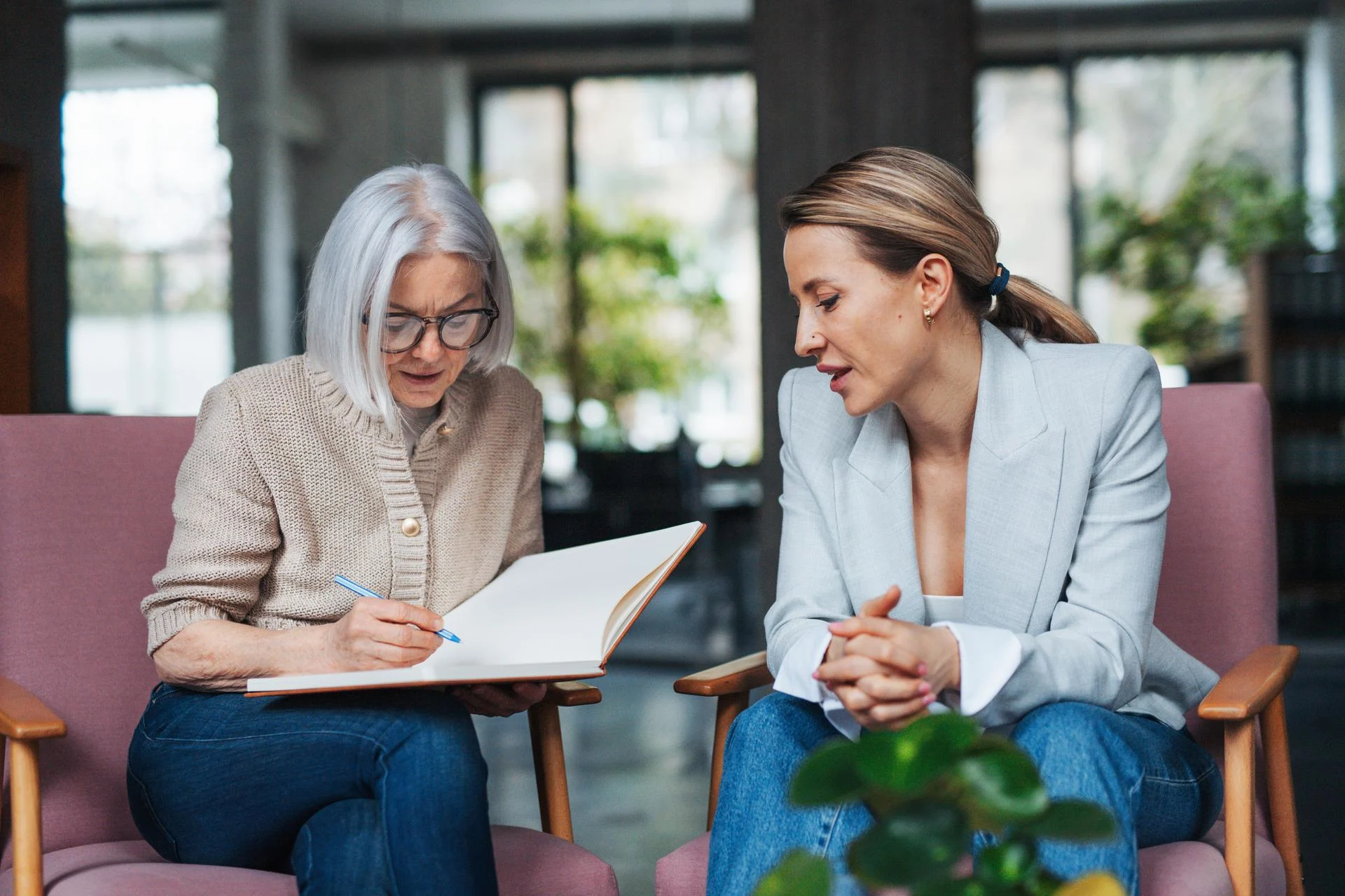 Workplace mental health coaching for female manager. Mental health coach helping to navigate stress, anxiety and manage work life balance for female worker.