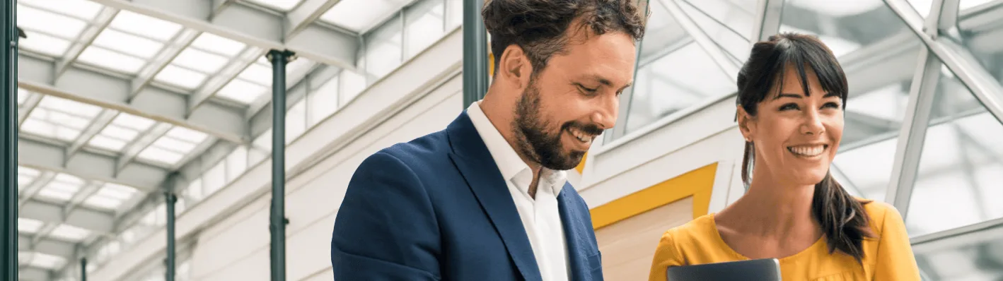 Man and woman smiling beside each other