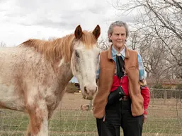 Dr Temple Grandin with Scatter, a 25-year-old Appaloosa gelding, on the ranch of her longtime research partner, Mark Deesing, in Fort Colllins, Colorado (Photo © Callen Liverance)