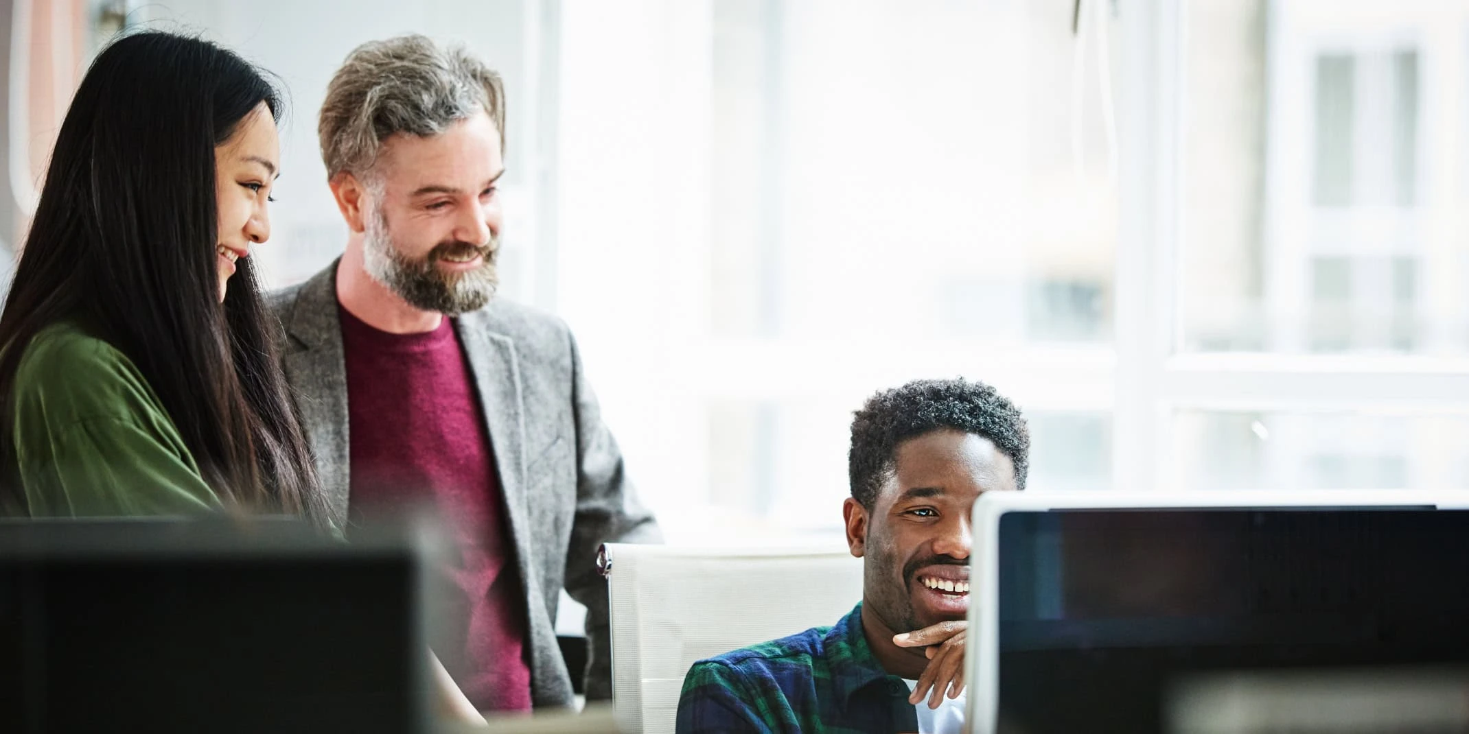 colleagues around a computer