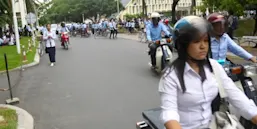 Students riding a motor bike in Cambodia Colleges
