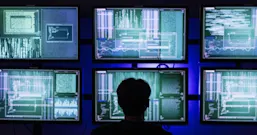 Hacker wearing mask explores server room