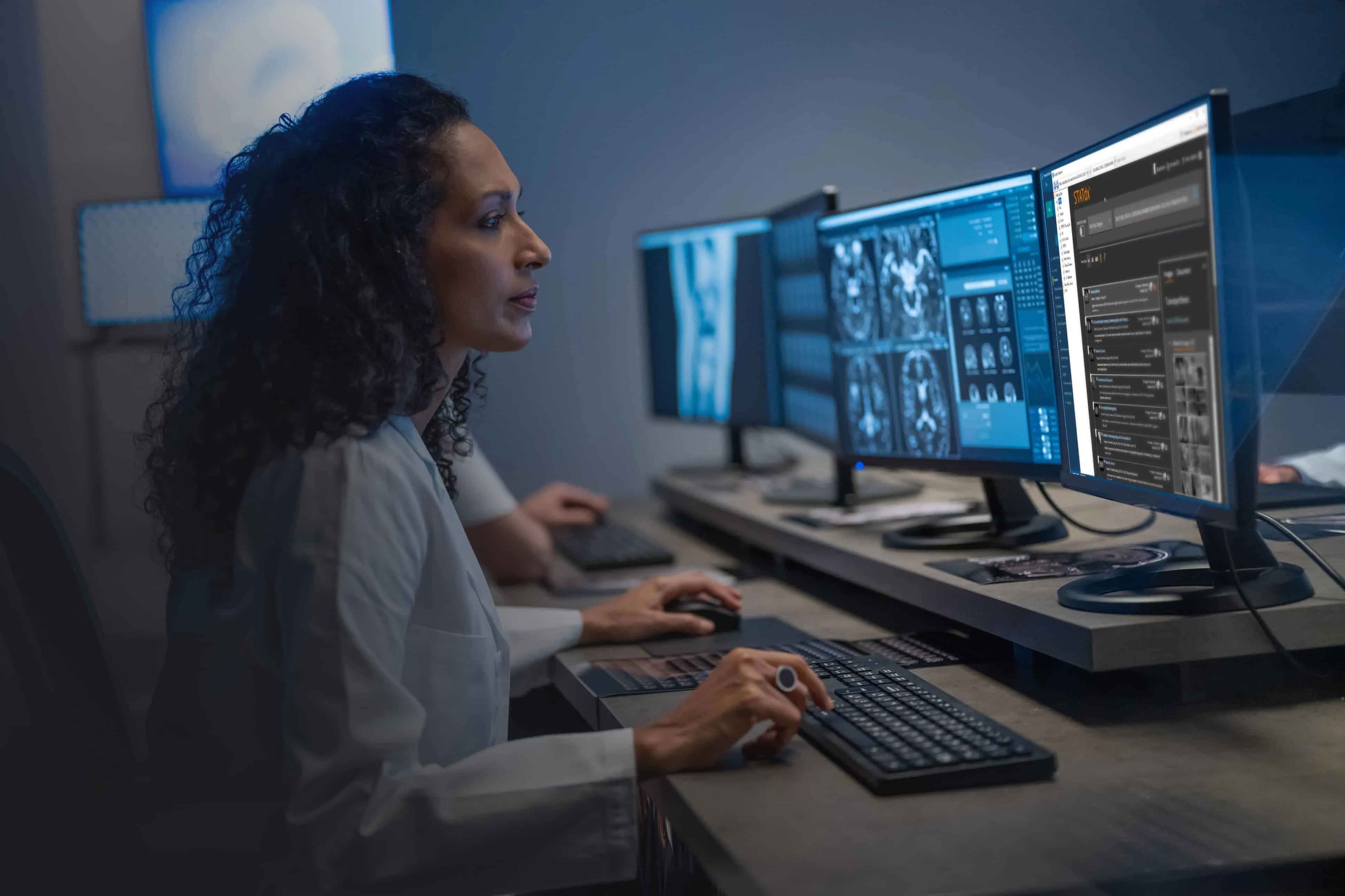 Radiologist reviewing scans using STATdx