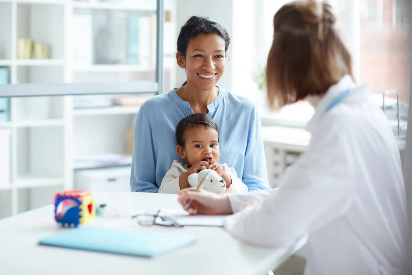 Woman with young child at doctor's appointment