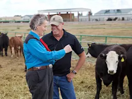 Dr Temple Grandin talks shop with her research and business partner Mark Deesing after they teach a class together at Colorado State University. (Photo by Alison Bert)