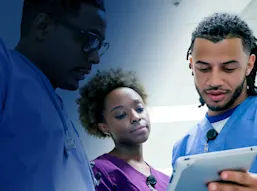 Three diverse nurses collaborating with a tablet