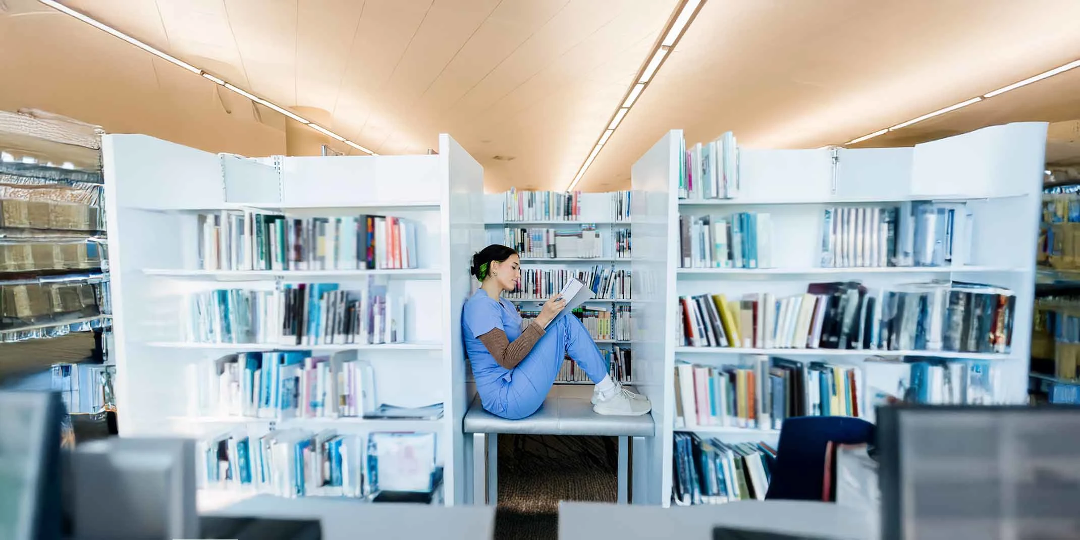 nurse reading a book in the library
