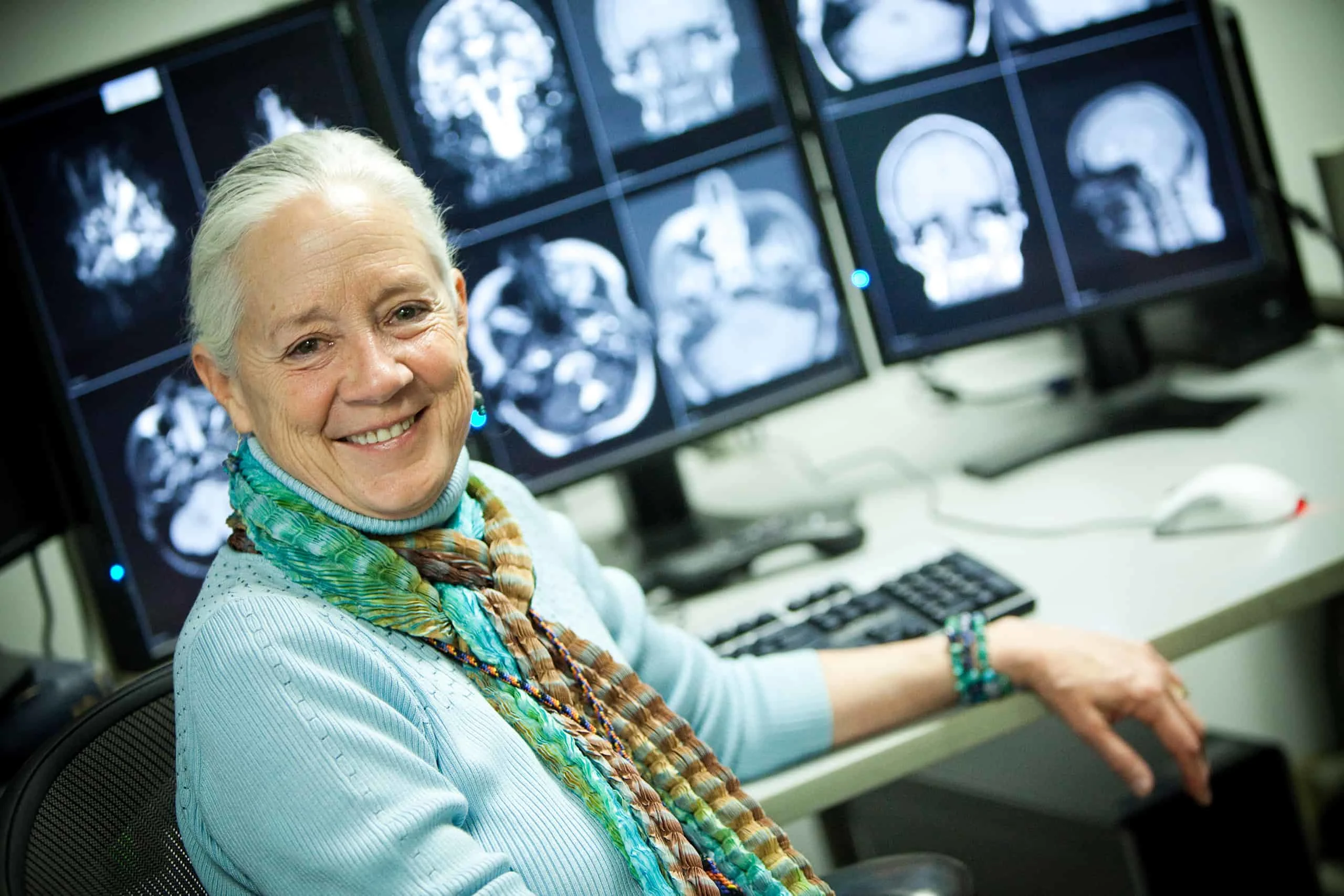 Dr. Anne Osborn in front of radiology screens