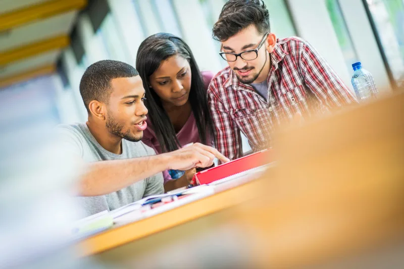 People at a desk working together