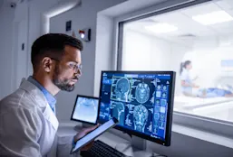Radiologist reviewing scans