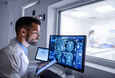 Radiologist reviewing scans