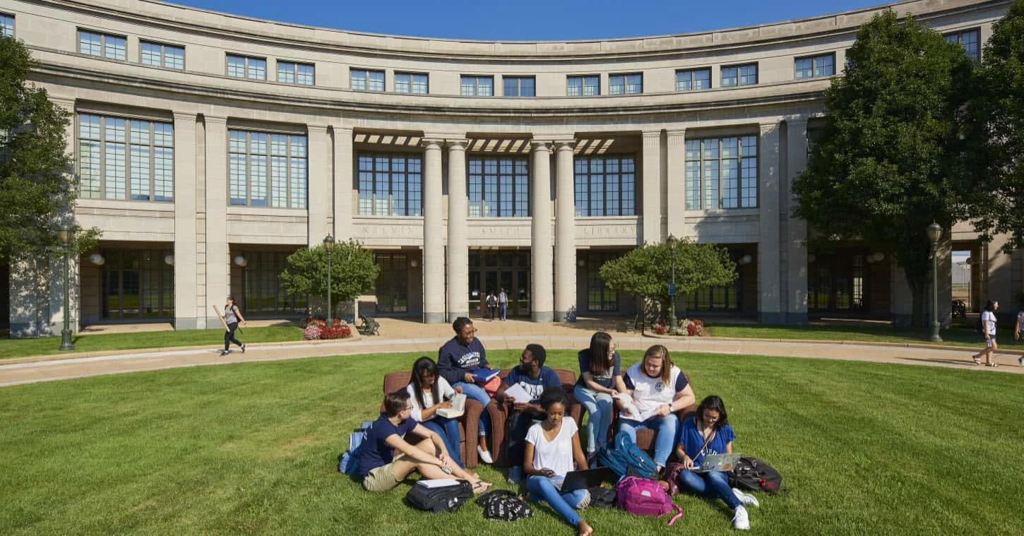 Group of students sitting outside Western Reserve University