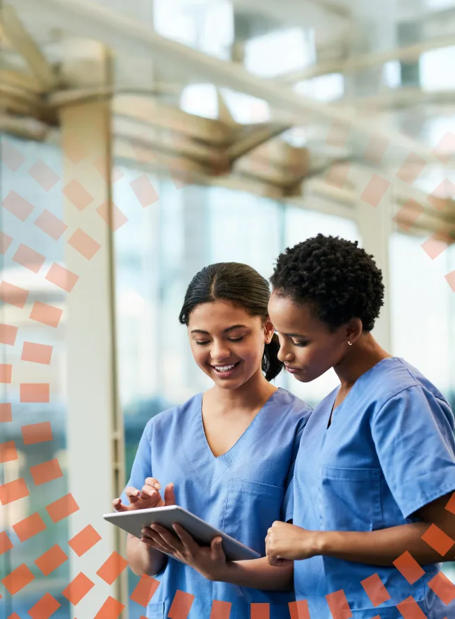 Two female nurses collaborating