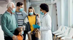 Female doctor talking to family