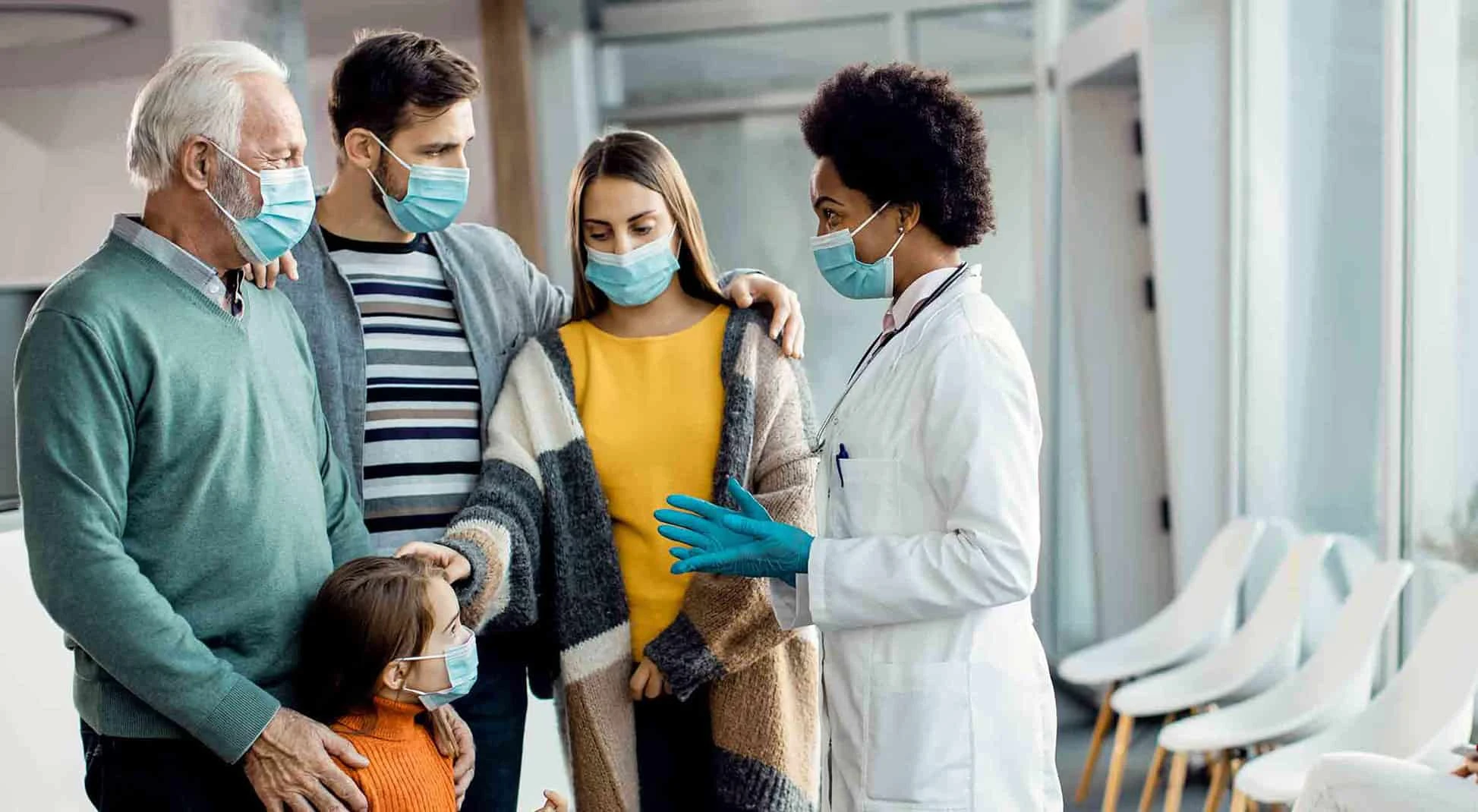 Female doctor talking to family