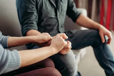 man and woman holding hands