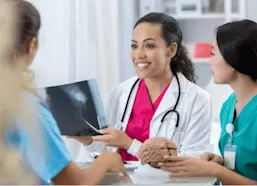 Healthcare professionals review patient's x-ray