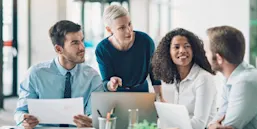 Multi-ethnic group of business persons talking in the office