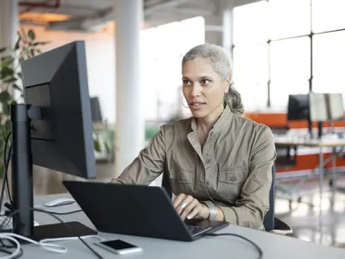 Image depicting a woman using AI on a computer (Photo: JohnnyGreig/E+ via Getty Images)