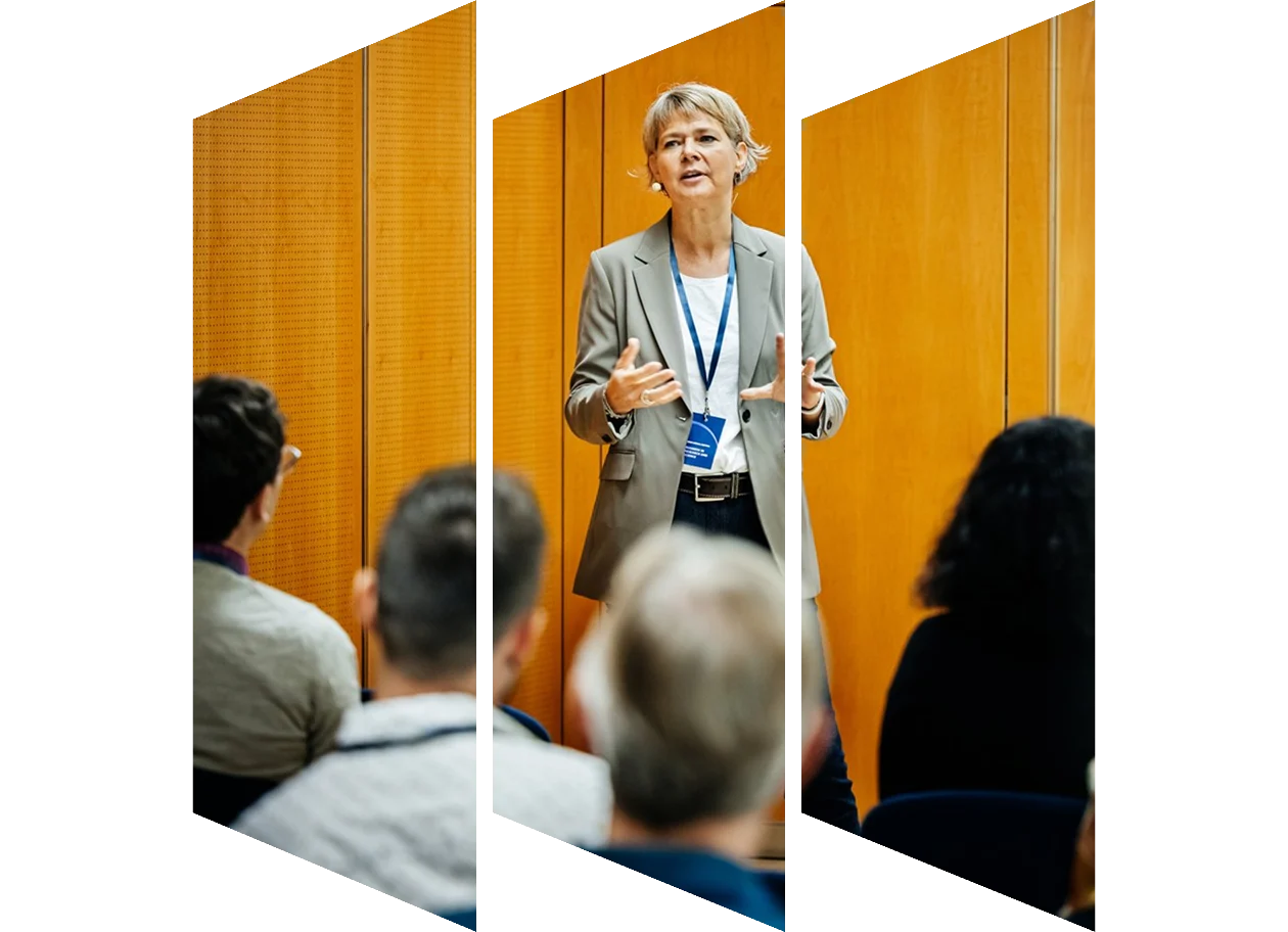 Businesswoman giving a presentation to a group of participants at a business conference