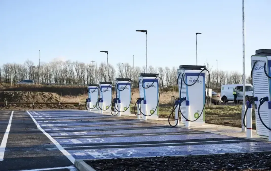 An empty row of bp pulse chargers on a bright day.