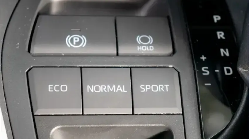 The buttons used to select either Eco, Normal, or Sport mode in an Electric Vehicle