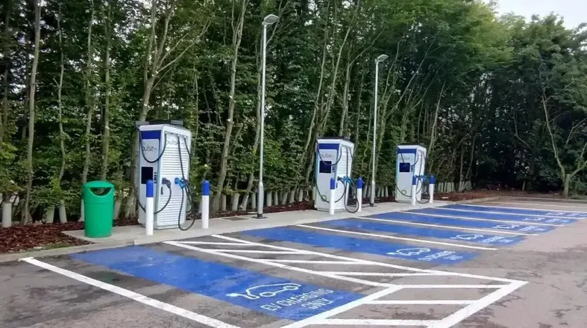 Six blue charging bays and three 150kW bp pulse chargers at charging hub near Stansted airport. 