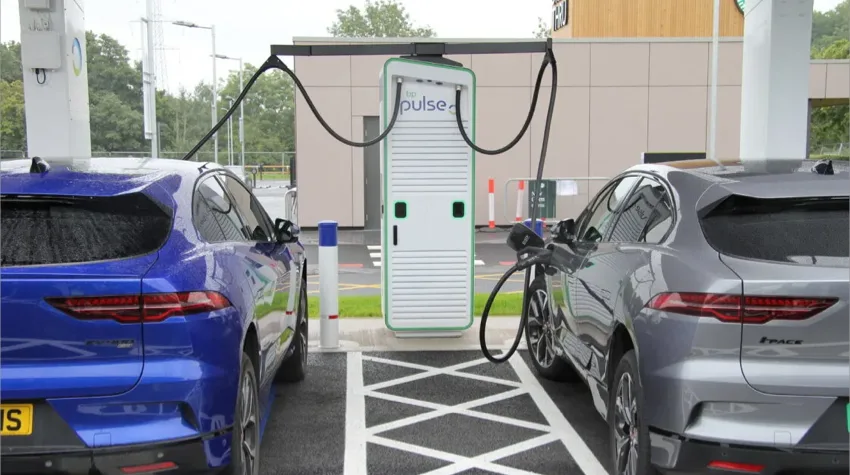 Two EVs charging at the largest public charging point in the UK in Birmingham. 