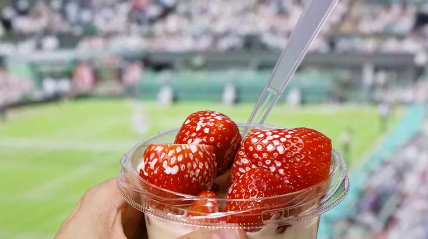 A small bowl of strawberries and cream.