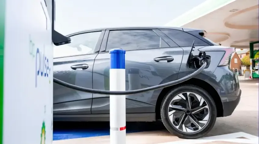 An electric car being charged at a bp pulse charging station.