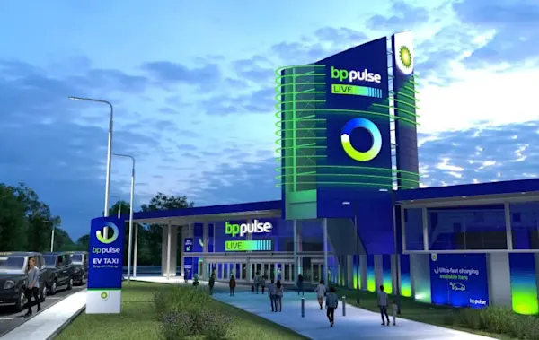 A graphic that visualises bp pulse LIVE - it has some cars parked on the road and some pedestrians walking on a path next to it.