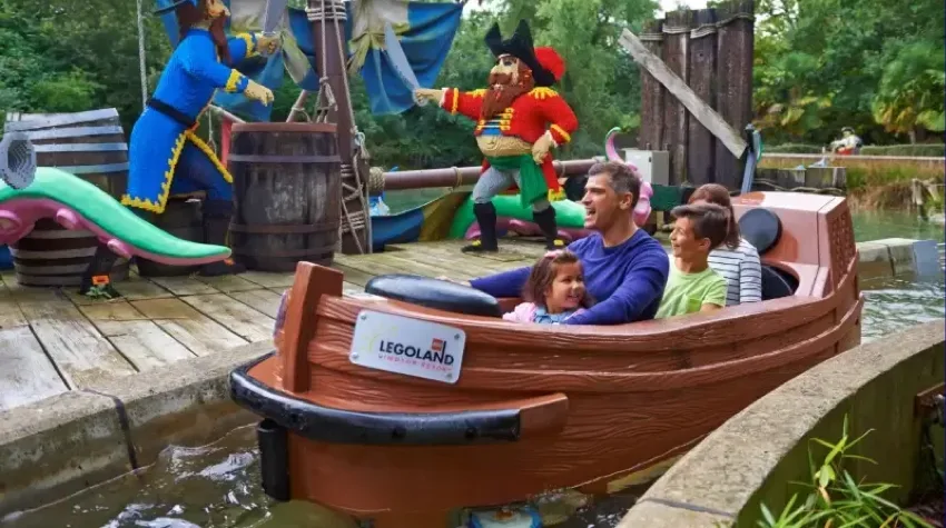 A family sits on a water ride at LEGOLAND.