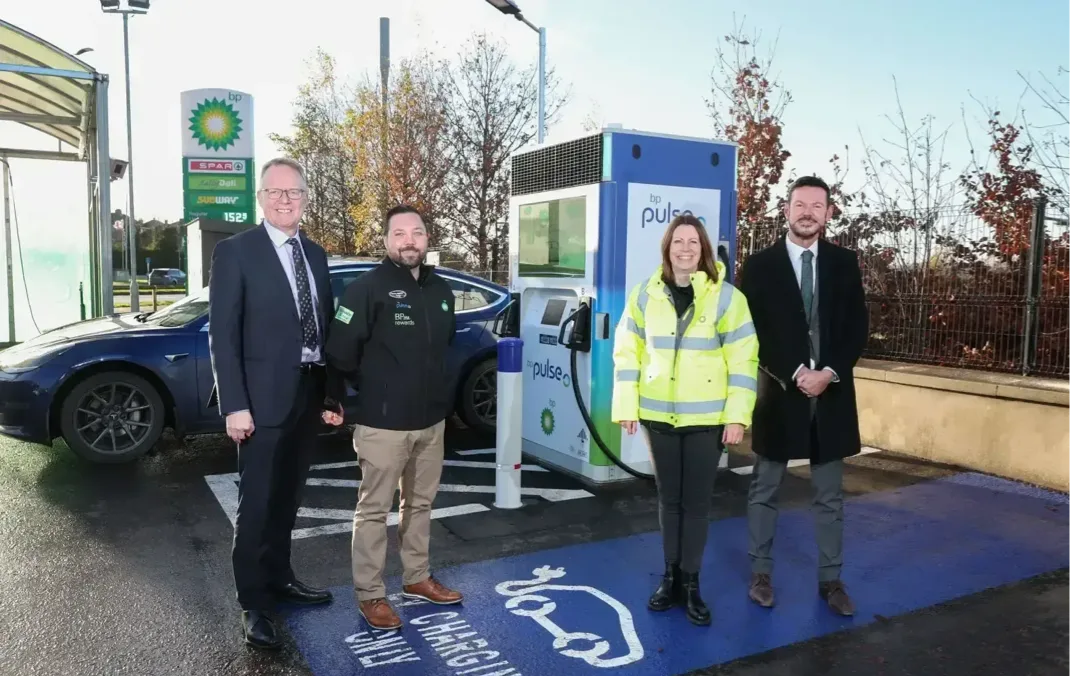 Stephen Hamilton and Ron Whitten from Henderson Group join Easton Boyd and Ailsa Wilkins from bp at one of the new bp pulse electric vehicle charging points.