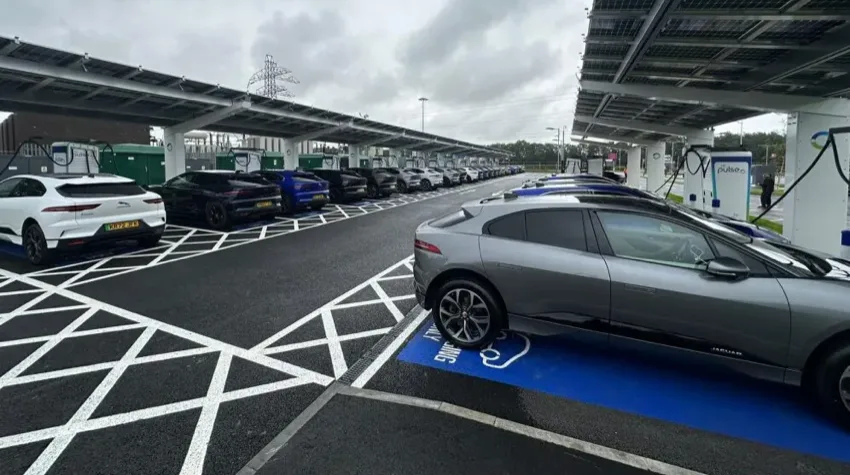 Numerous cars all charging in the UK's largest public charging hub in Birmingham. 