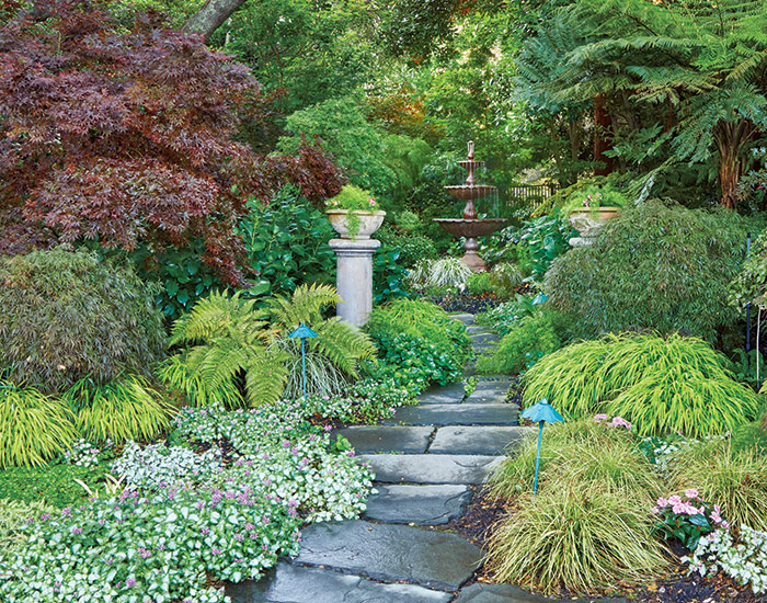 Ruby Andrews fountain path: The stone path through colorful foliage leads your
eye right to the destination — the tiered fountain.