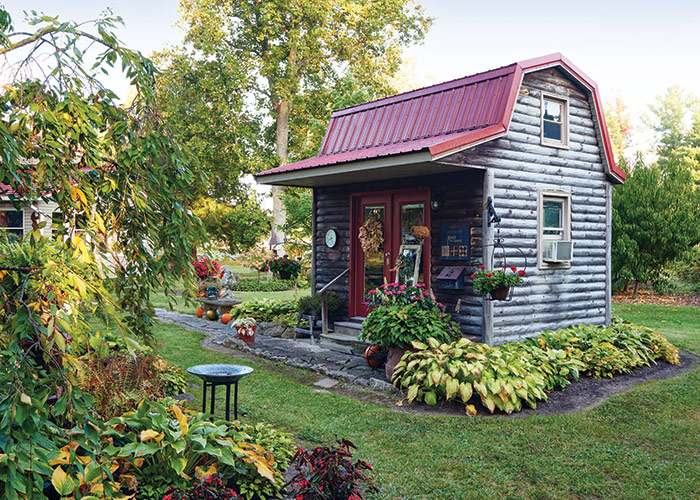 Light Feature Garden Shed: This 9x14-foot shed sits on a large salvaged skid. Rachel sews and stores seasonal decorations here. 