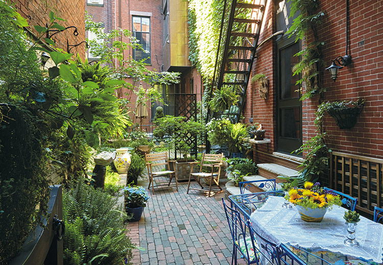 Urban Garden, vertical garden, patio: Surrounded by lush foliage, what was once a utilitarian area for this historic Boston home has been transformed into a retreat where the homeowner can recharge her batteries.