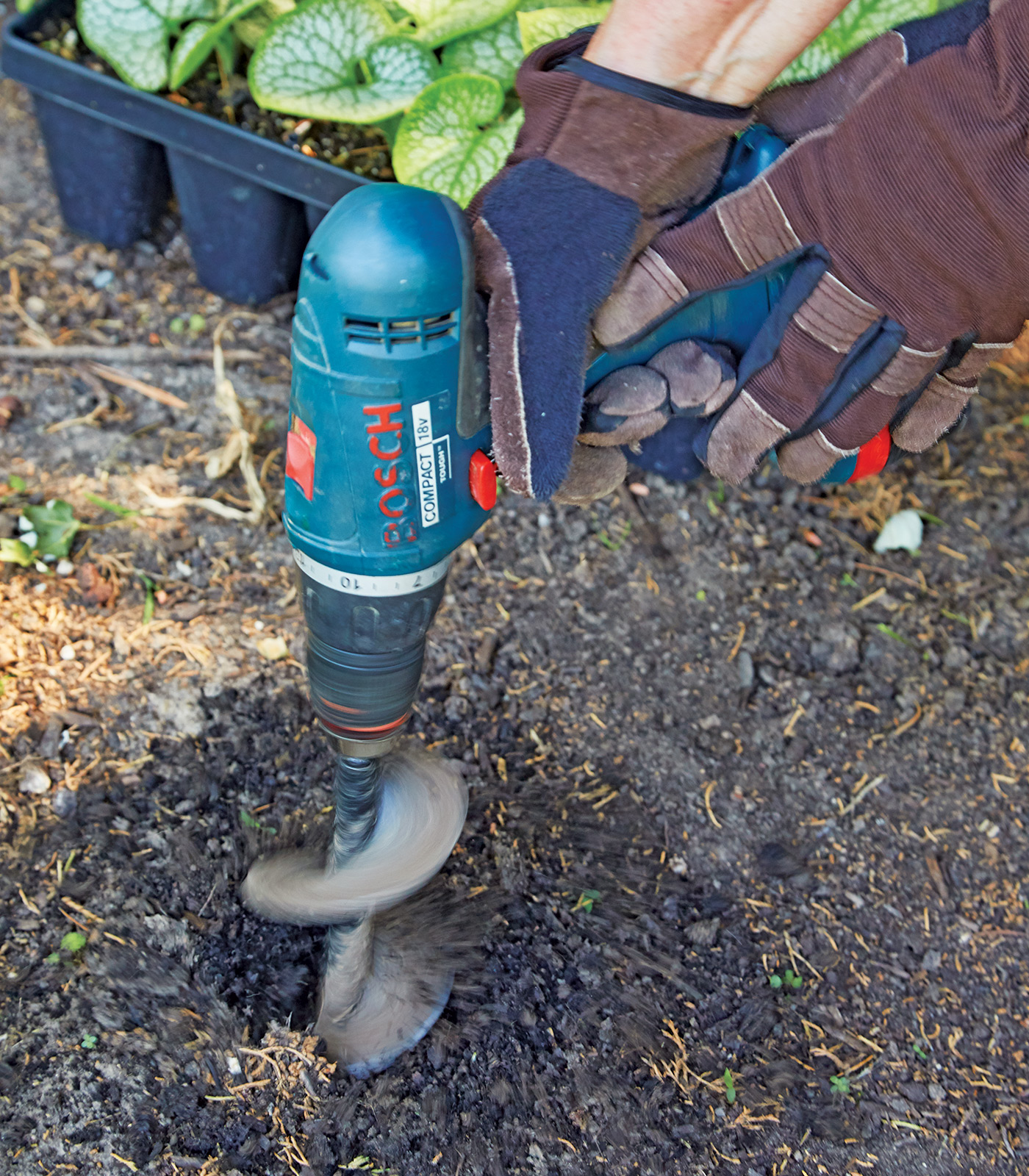 Auger attachment for drill: A 4-inch Power Planter auger bit drills a perfect hole for small plants. 