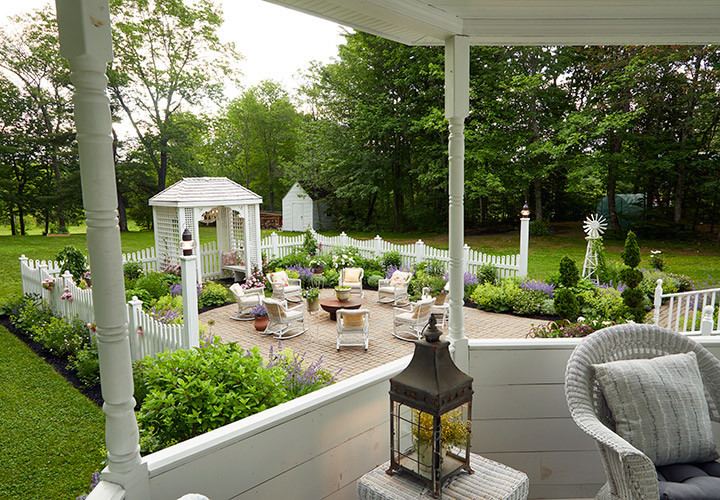 Clark cottage gardens patio seating: The view of this charming cottage-inspired garden from the gazebo.
