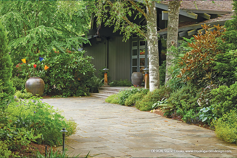 Front entry pathway garden design by Stacie Crooks, www.crooksgardendesign.com: Add lighting along the path to provide a warm welcome and safer nighttime walking for visitors. Space them every 10 to 15 feet for good coverage that isn’t too bright.
