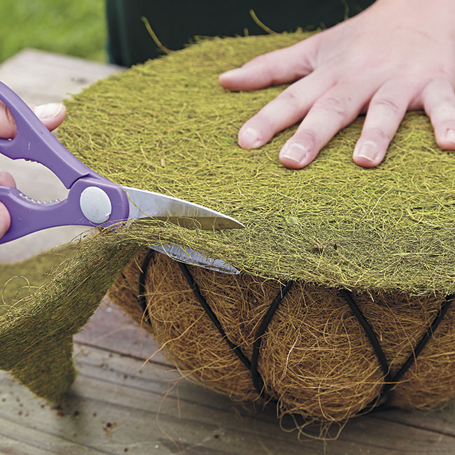 trim-coco-liner: It doesn't matter what color the circle of coco liner is since it will be pressed up to the plywood backing and won't be seen later.