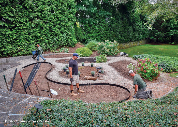 Steel garden Edging courtesy of Janie McCabe: Janie McCabe uses steel edging and leaves the top inch exposed. This makes a defined edge that keeps most lawn grass roots out. 