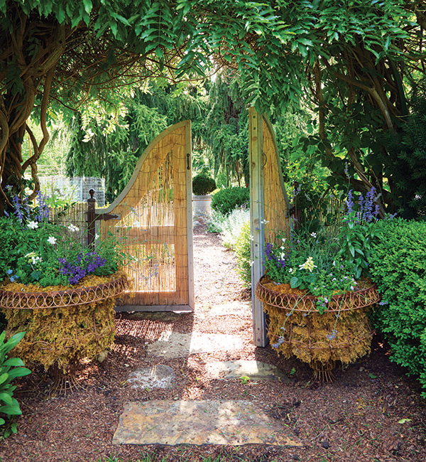 Sensory garden gravel path with gate: Even walking into a garden offers auditory delight — the crunch of gravel underfoot, the rustle of leaves in the breeze and the creak of the gate welcomes you.
